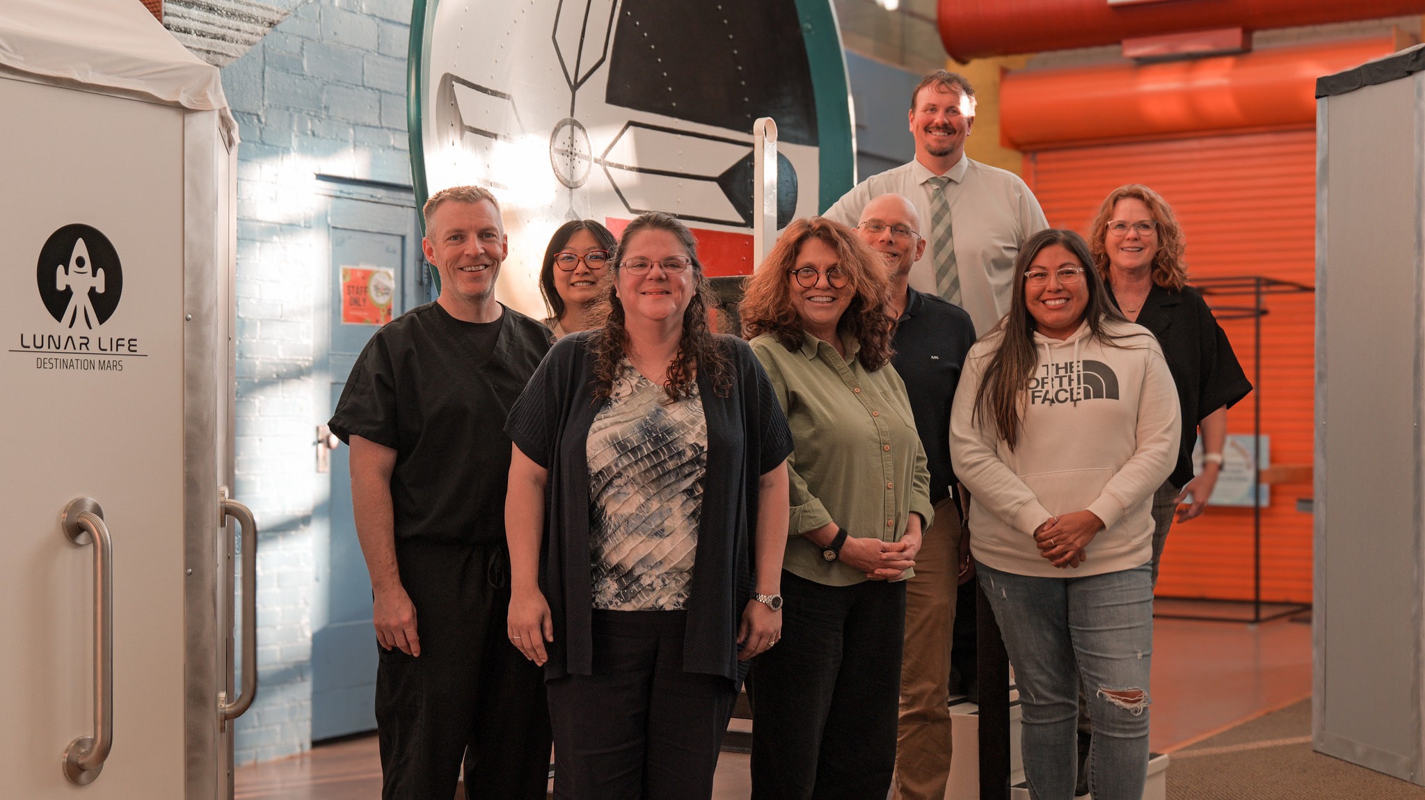 South Dakota Discovery Center Board of Directors in front of South Dakota Discovery Center Exhibits Lunar Life, and Whisper Dishes